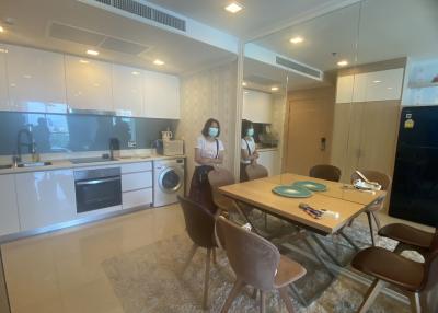 Modern kitchen area with dining space and appliances