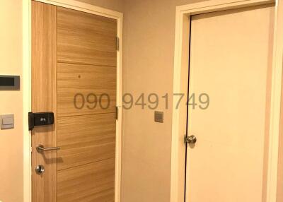 Wooden entry doors with security lock in a home interior