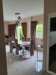 Elegant dining room with natural light and modern furnishings