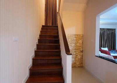 Modern wooden staircase in a well-lit home interior