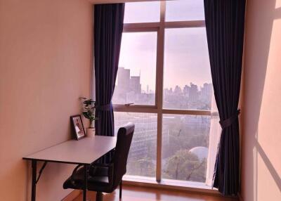 Cozy bedroom with a view and a workspace