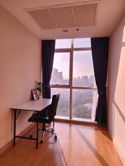 Cozy bedroom with a view and a workspace