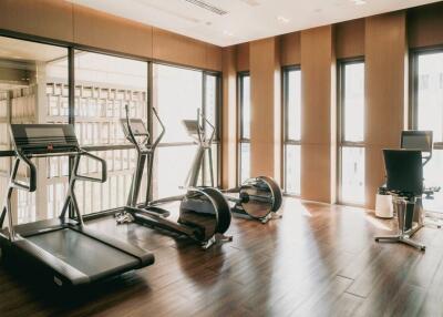 Home gym with modern equipment and large windows