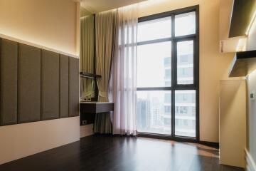 Modern bedroom with large window and city view