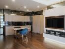 Modern kitchen with integrated appliances and breakfast bar