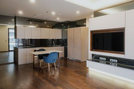 Modern kitchen with integrated appliances and breakfast bar