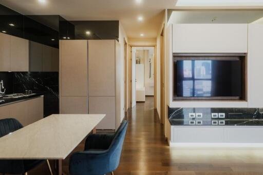 Modern kitchen with integrated appliances and marble countertop