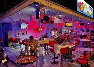 Vibrant themed restaurant interior with diners and eclectic decor