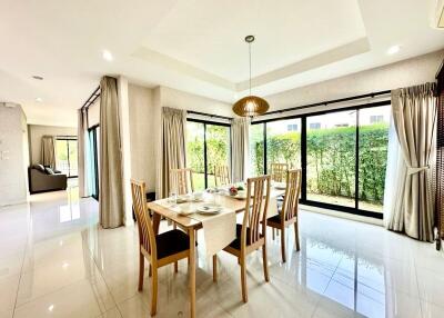 Bright and spacious dining room with large windows and garden view