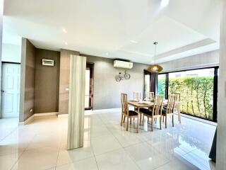 Spacious and well-lit dining room with large windows