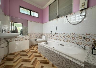 Spacious bathroom with modern facilities and patterns tiles
