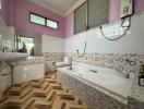 Spacious bathroom with modern facilities and patterns tiles