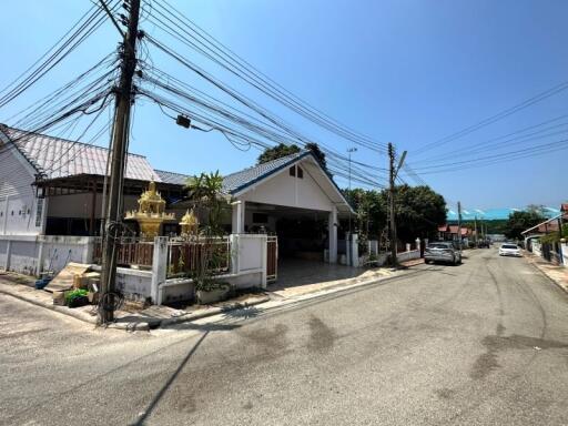 Suburban house exterior with street view and clear sky