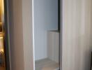 Modern built-in wardrobe with open sliding door