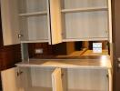 Modern kitchen with open wooden cabinets showing shelving spaces