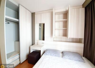 Cozy modern bedroom with built-in wardrobe and shelving units