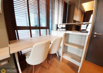 Modern kitchen with dining area and wooden blinds