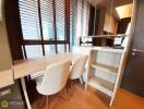 Modern kitchen with dining area and wooden blinds