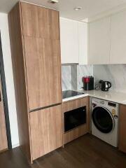 Modern kitchen with wooden cabinets and built-in appliances