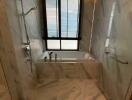 Modern bathroom with marble tiles and natural light