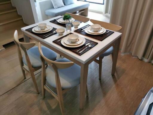 Modern dining area with set table