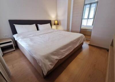 Cozy bedroom with a large bed and natural lighting