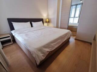 Cozy bedroom with a large bed and natural lighting