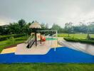 Children's playground with playset and safety flooring in a residential backyard