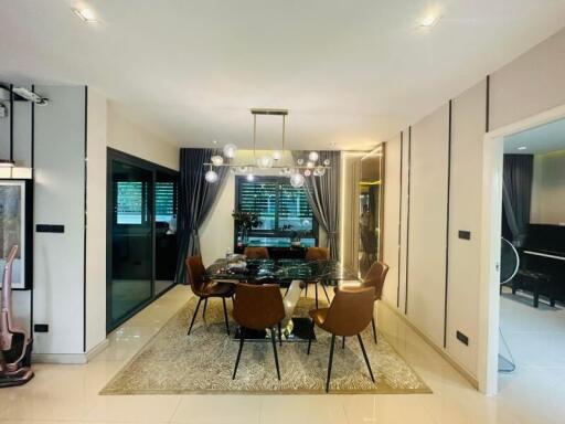 Elegant dining room with modern furniture and chandelier