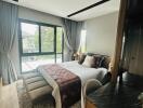 Modern bedroom with large windows and stylish interior