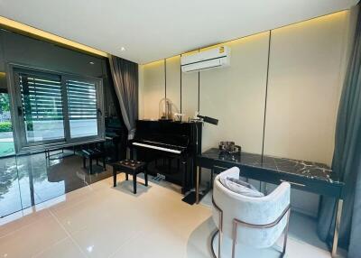 Elegant music room with grand piano and contemporary design