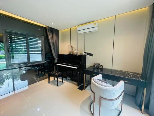 Elegant music room with grand piano and contemporary design