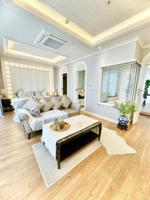 Elegant and spacious living room with natural lighting
