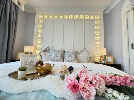 Elegant bedroom with decorative headboard and stylish interior