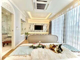 Elegant contemporary bedroom with sophisticated decor and en suite bathroom