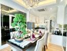 Elegant dining room with chandelier and open concept kitchen