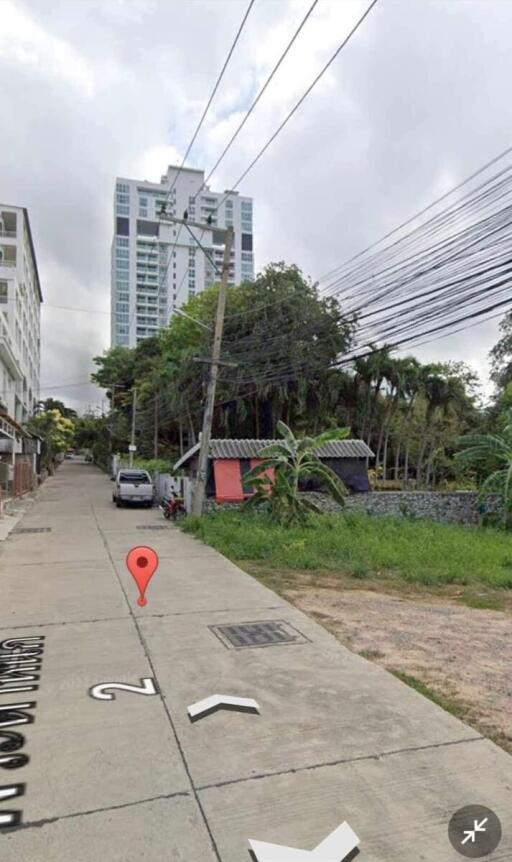 Urban street with buildings and overhead power lines