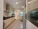 Modern kitchen with stainless steel appliances and ample cabinetry