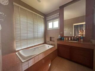 Spacious bathroom with modern fixtures and natural light