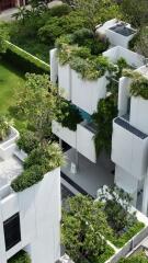 Aerial view of modern residential buildings with rooftop gardens