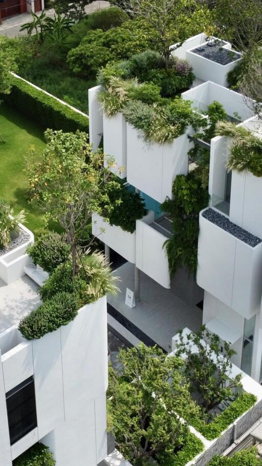 Aerial view of modern residential buildings with rooftop gardens