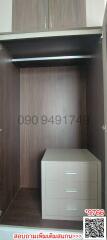 Spacious built-in wooden wardrobe with shelving and drawer unit