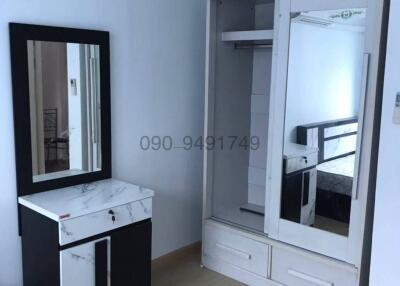 Compact bedroom with built-in wardrobe and vanity