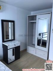 Compact bedroom with built-in wardrobe and vanity