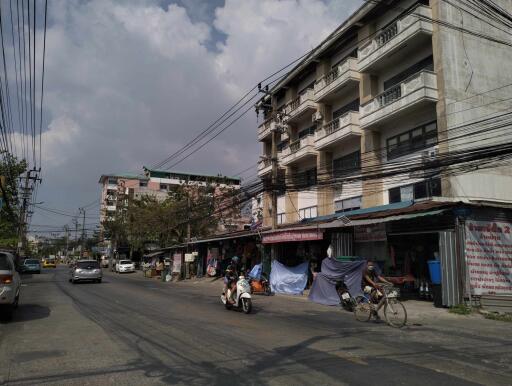 Urban street with residential buildings and local shops