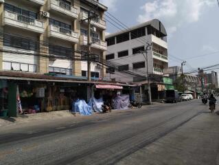 Street view with residential buildings and local shops