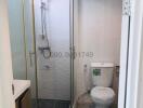 Compact modern bathroom with shower and toilet