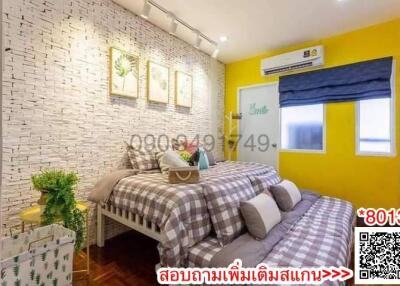 Cozy bedroom with modern interior design, brick wall accent, and vibrant color scheme