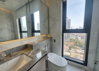 Modern bathroom with marble finish and city view