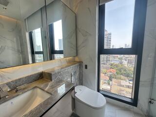 Modern bathroom with marble finish and city view